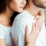 cropped view of woman embracing boyfriend at home