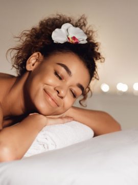 massage-african-american-girl-relaxing-in-spa-FPA9EM2.jpg